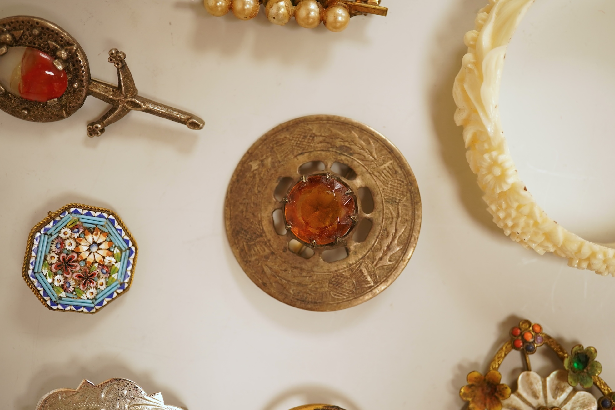 A small group of assorted jewellery including a gold plated curb link bracelet, silver brooch, simulated pearl necklace and costume.